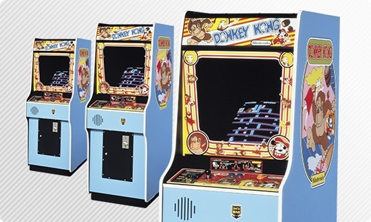 Three Donkey Kong individual coin-operated video game machines.