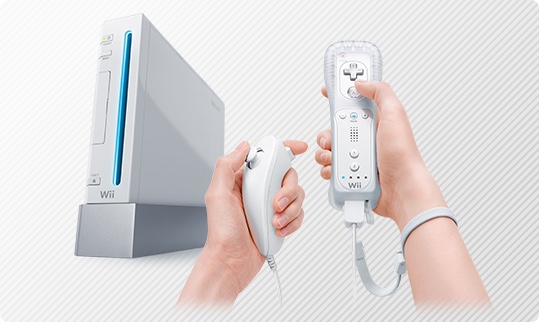 Nintendo Wii home gaming system and pair of hands using Wii Remote and Wii Nunchuk Controller.